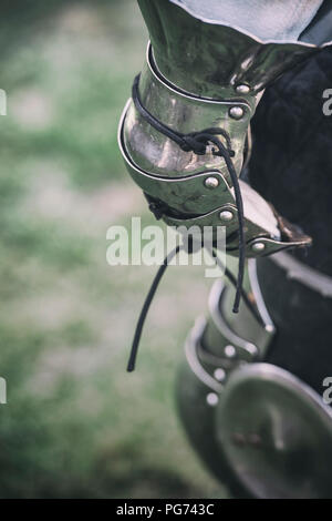 Detail of a member of a reenactment society wearing medieval armour Stock Photo