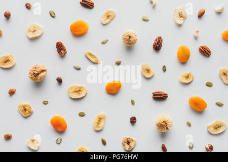 top view of tasty dried fruits and nuts isolated on white background Stock Photo