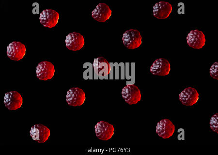 collection of red jelly candies in shape of raspberries isolated on black Stock Photo