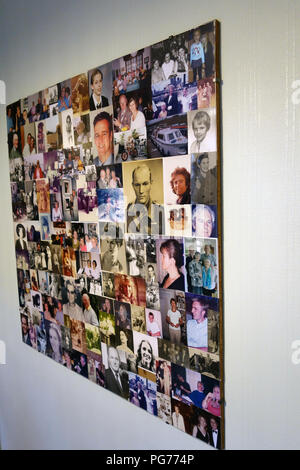 Collage of a collection of family photographs in one perspex frame hanging on the wall Stock Photo