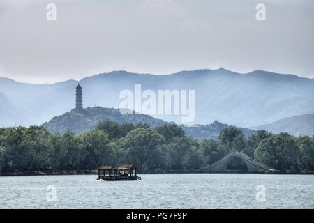 The Jade Belt Bridge, also known as the Camel's Back Bridge across the Kunming Lake, is located  on the grounds of the Summer Palace in Beijing. Stock Photo