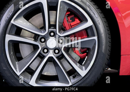 Detailing series. Clean super car disc-brake. Red rims from sports car. Stock Photo