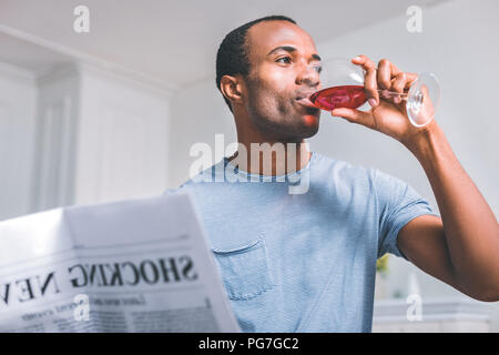 Sad man drinking wine Stock Photo