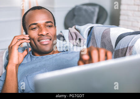 Handsome man pointing on the screen Stock Photo