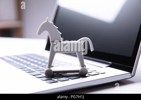 Close-up Of Trojan Horse Icon On Laptop Keypad Stock Photo