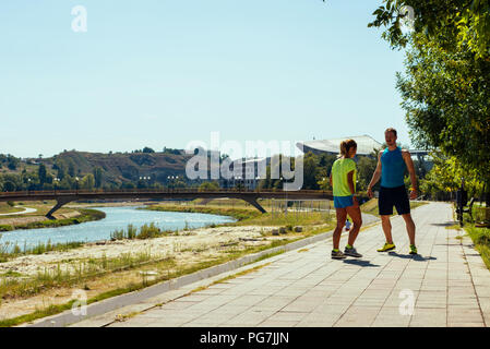 Young couple prepare to jogging in the park at summer day Stock Photo