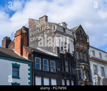 A faded old sign for 'Phillips Charles Jewellers' on Rallagh Street, Liverpool, Merseyside, Uk. Stock Photo