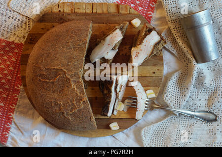 smoked lard with spice and different bread  on the board Stock Photo