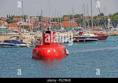 Red Semi-submarine with glass bottom so tourists can see the marine life in Vodice, Croatia Stock Photo