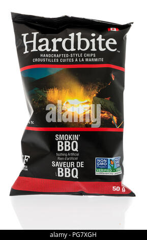 Winneconne, WI - 20 August 2018: A package of Harbbite smokin' BBQ chips from Canada on an isolated background Stock Photo