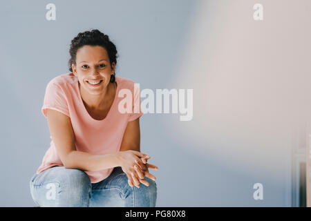 Confident woman smiling happily Stock Photo