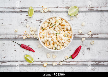 Bowl of popcorn flavoured with chili and lime Stock Photo