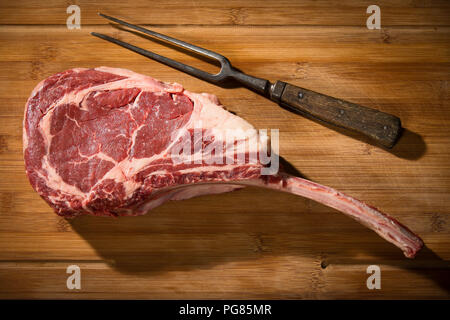 Raw tomahawk steak Stock Photo