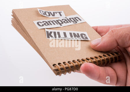 Torn Newspaper Title on a notebook Stock Photo