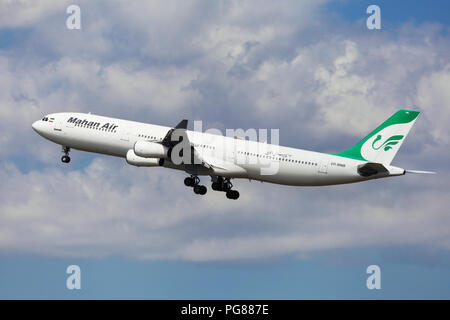 Barcelona, Spain - August 15, 2018: Mahan Air Airbus A340-300 taking off from El Prat Airport in Barcelona, Spain. Stock Photo