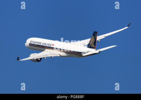 Barcelona, Spain - August 20, 2018: Singapore Airlines Airbus A350-900 banking left after taking off from El Prat Airport in Barcelona, Spain. Stock Photo