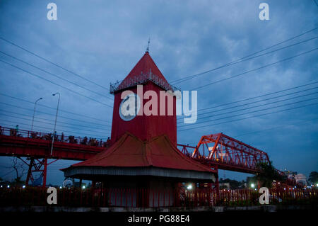 Ali Amzad's Clock House and the Kean Bridge over the Surma River in Sylhet. Sylhet, Bangladesh. Stock Photo