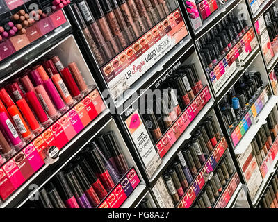 Lipstick display in a cosmetics store. Stock Photo