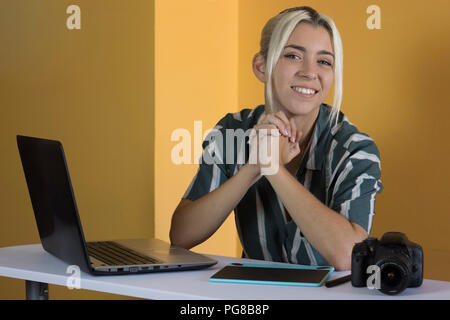 Freelance, working with a digital tablet and a laptop Stock Photo