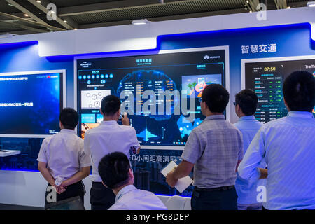 Smart city exhibits, urban big data, digital control systems, hi-tech monitoring technology, people at Fourth China Smart City Expo 2018 in Shenzhen, China. Stock Photo
