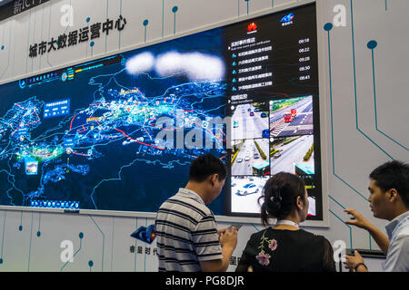 Smart city exhibits, urban big data, digital control systems, hi-tech monitoring technology, people at Fourth China Smart City International Expo 2018 in Shenzhen, China. Stock Photo