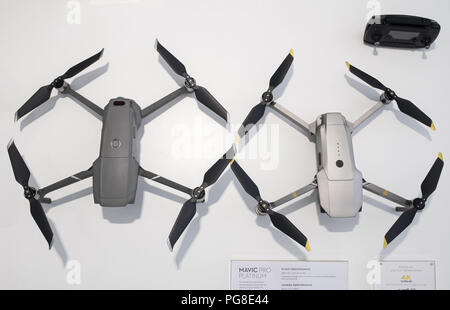 Hong Kong, Hong Kong Island. 24th Aug, 2018. A drone size comparison between the new DJI Mavic 2 Pro (Left) and DJI Mavic Pro Platinum (Right) at the Chinese multinational technology company DJI flagship store in Hong Kong.Drone manufacturing leader DJI releases 2 of it's latest products, the Marvic 2 pro and the Marvic 2 zoom on 23rd August 2018. The Marvic 2 Pro is equipped with a upgraded 1 inch camera sensor for improved quality, while the Marvic 2 zoom allows users to use the digital zoom function in flight. Credit: Miguel Candela/SOPA Images/ZUMA Wire/Ģ����ý Live News Stock Photo