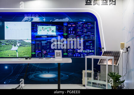 Smart city exhibits, urban big data, digital control systems, hi-tech monitoring technology, people at China Smart City Expo in Shenzhen, China. Stock Photo