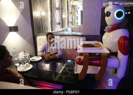 Kathmandu, Nepal. 24th Aug, 2018. A robot serves food to customers at Naulo Restaurant, an automated restaurant in Kathmandu, Nepal, Aug. 24, 2018. Credit: Sunil Sharma/Xinhua/Alamy Live News Stock Photo