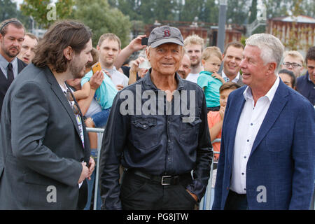 Worms, Germany. 24th August 2018. Actor Peter Englert, who initiated the renaming of the bridge to Terence-Hill-Bridge, Terence Hill and the Lord Mayor of Worms Michael Kissel are pictured from left to right. Italian actor Terence Hill visited the German city of Worms, to present his new movie (My Name is somebody). Terence Hill added the stop in Worms to his movie promotion tour in Germany, to visit a pedestrian bridge, that is unofficially named Terence-Hill-Bridge (officially Karl-Kubel-Bridge). Stock Photo