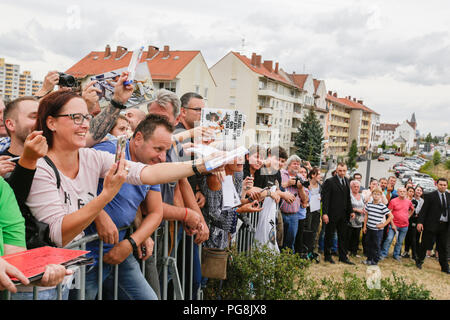 Worms, Germany. 24th August 2018. Fans shout towards Terence Hill and wave things for him to sign. Italian actor Terence Hill visited the German city of Worms, to present his new movie (My Name is somebody). Terence Hill added the stop in Worms to his movie promotion tour in Germany, to visit a pedestrian bridge, that is unofficially named Terence-Hill-Bridge (officially Karl-Kubel-Bridge). Stock Photo