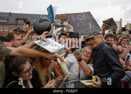 Worms, Germany. 24th August 2018. Terence Hill poses for a picture with his fans. Italian actor Terence Hill visited the German city of Worms, to present his new movie (My Name is somebody). Terence Hill added the stop in Worms to his movie promotion tour in Germany, to visit a pedestrian bridge, that is unofficially named Terence-Hill-Bridge (officially Karl-Kubel-Bridge). Stock Photo