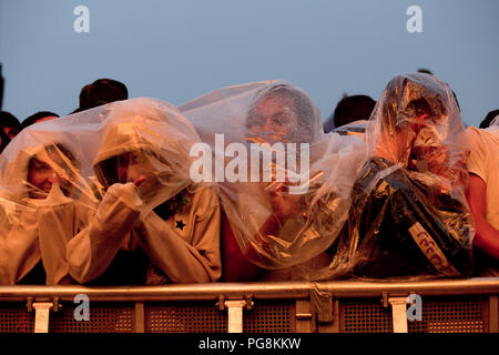 Fans wait in the rain for Travis Scott to perform on the main stage on day one at reading festival 2018 Stock Photo