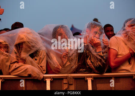 Fans wait in the rain for Travis Scott to perform on the main stage on day one at reading festival 2018 Stock Photo