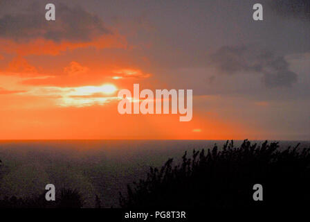Portland. 24th August 2018. UK Weather: Dramatic sunset over Lyme Bay as stormy weather kicks off the Bank Holiday weekend in Portland Credit: stuart fretwell/Ģ����ý Live News Stock Photo