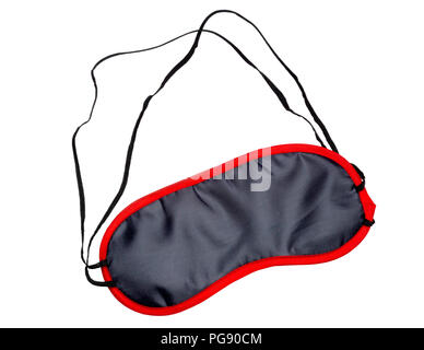 Black satin mask with red rim for sleeping on isolated white background. Stock Photo