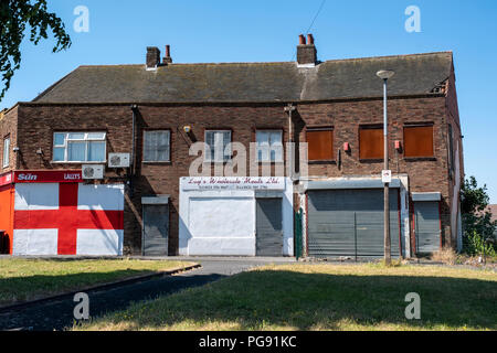 St. George's flag painted on wall of housing estate shops, Wednesbury, West Midlands. Stock Photo