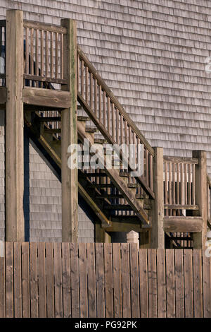 Wooden stairs in front of wall of brown wooden shingles outside the Hector Heritage Quay in Pictou, Nova Scotia Stock Photo