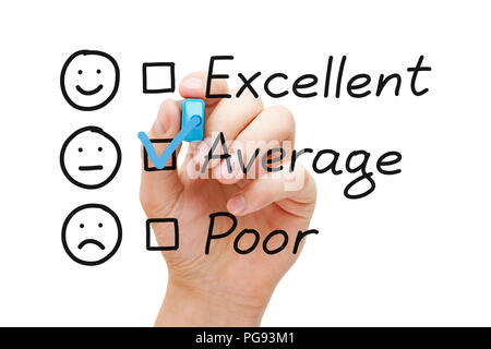 Hand putting check mark with blue marker on average customer service evaluation form. Stock Photo