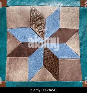 stitched star pattern from leather pieces on decorative pillow Stock Photo