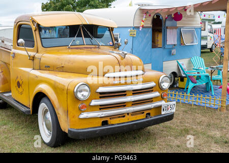 Dodge Pick up truck and caravan at a vintage retro festival. UK