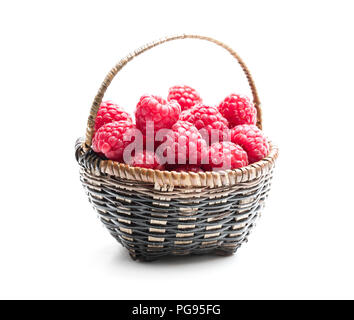 Fresh  raspberries in a small wicker basket Stock Photo