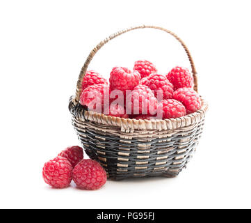 Fresh  raspberries in a small wicker basket Stock Photo