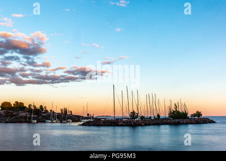 Colorful sunset on the peaceful marina in Helsinki in summer - 10 Stock Photo