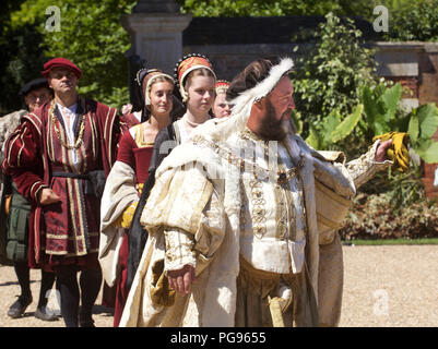 KIng Henry Eigth and courtiers (played by actors at Hamton Court Place London) Stock Photo