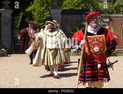 KIng Henry Eigth and courtiers (played by actors at Hamton Court Place London) Stock Photo