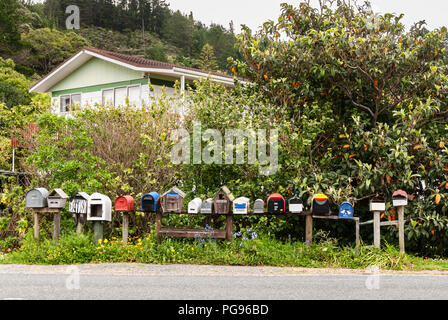 A row of roadside traditional letter boxes in Te Ngaere, Kaeo, Northland, New Zealand. 02 November 2007 Stock Photo