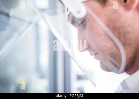 Lab technician wearing a face shield. Stock Photo