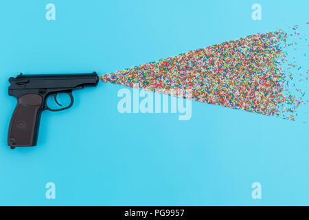 Pistol shooting sweets. Stock Photo
