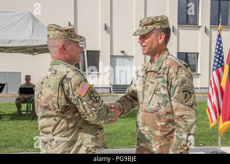 Lt. Gen. Christopher G. Cavoli (left), Commander of United States Army Europe (USAREUR) places the USAREUR Patch on the Uniform of Maj. Gen. Andrew M. Rohling, incoming Deputy Commander of USAREUR during the Welcome Patch Ceremony held on Clay Kaserne in Wiesbaden, Germany, Aug. 20, 2018. Stock Photo