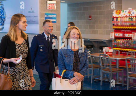 Valerie Nessel, right, the widow of U.S. Air Force Tech. Sgt. John Chapman, walks alongside her daughter Brianna, left, to her airline gate at Destin-Fort Walton Beach Airport, Florida, Aug. 20, 2018. President Donald Trump will posthumously award the Medal of Honor to Chapman's family at a ceremony on August 22 for his extraordinary heroism in March 2002 while deployed to Afghanistan. (U.S. Air Force photo by Senior Airman Joseph Pick) Stock Photo